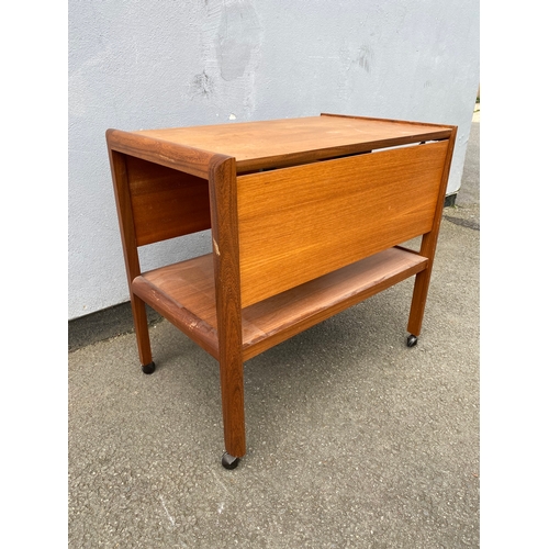 281 - Mid century drop leaf table on wheels.