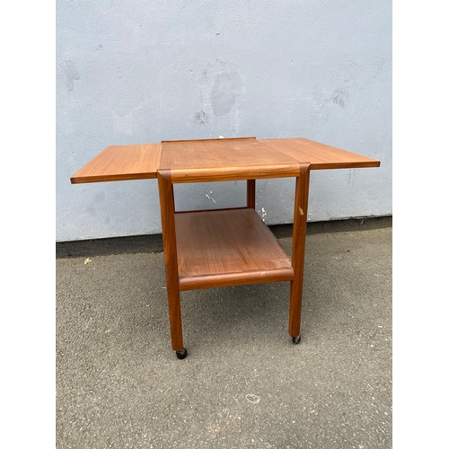 281 - Mid century drop leaf table on wheels.