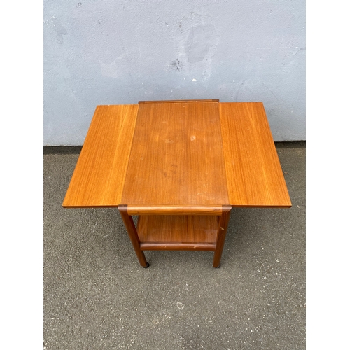 281 - Mid century drop leaf table on wheels.