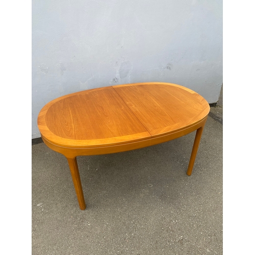 286 - A beautiful mid century teak Nathan extendable dining table and six G Plan chairs.