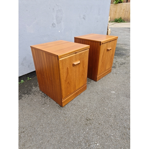 293 - A pair of mid century teak bedside tables