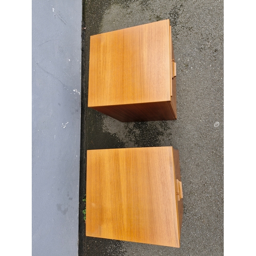 293 - A pair of mid century teak bedside tables