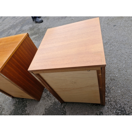 293 - A pair of mid century teak bedside tables