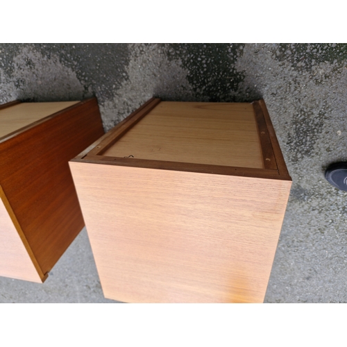 293 - A pair of mid century teak bedside tables