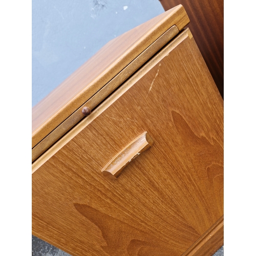 293 - A pair of mid century teak bedside tables