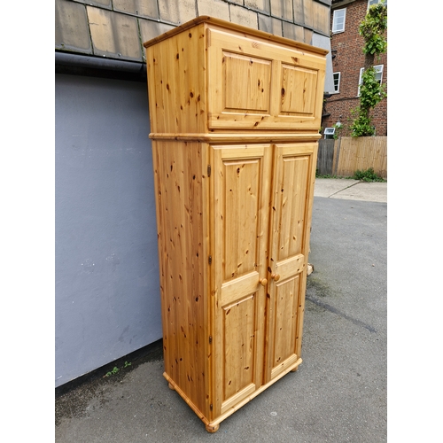 300 - Large Bellamy Ducal Pine double wardrobe and over head storage compartment