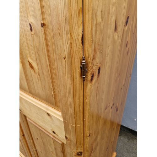 300 - Large Bellamy Ducal Pine double wardrobe and over head storage compartment