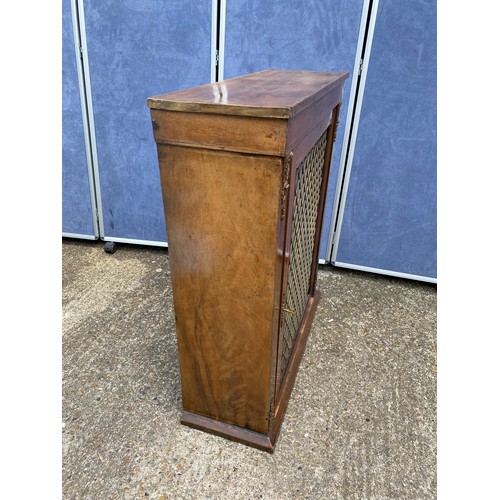 309 - Regency Mahogany Side cabinet with brass grills enclosing shelving 73cm x 23cm x 93cm