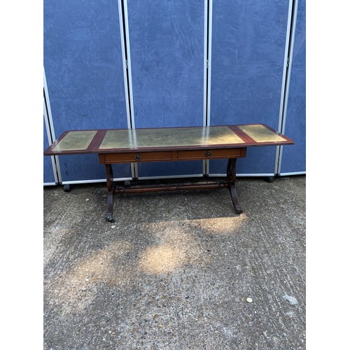 311 - 20th century mahogany and leather top coffee table with drop leaf extenders