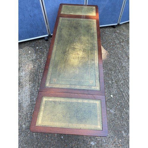 311 - 20th century mahogany and leather top coffee table with drop leaf extenders