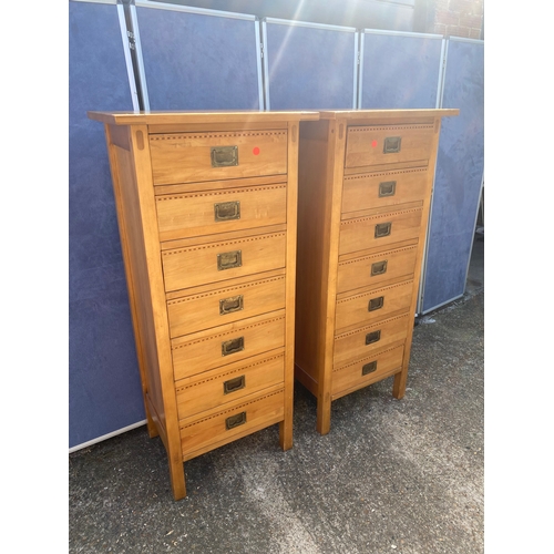 335 - A matching pair of seven drawer satinwood tall boy units with marquetry