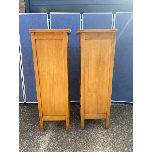 335 - A matching pair of seven drawer satinwood tall boy units with marquetry