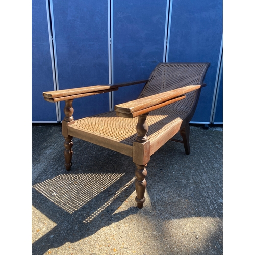 341 - EARLY 20TH CENTURY TEAK COLONIAL PLANTERS CHAIR WITH RATTAN WEAVE