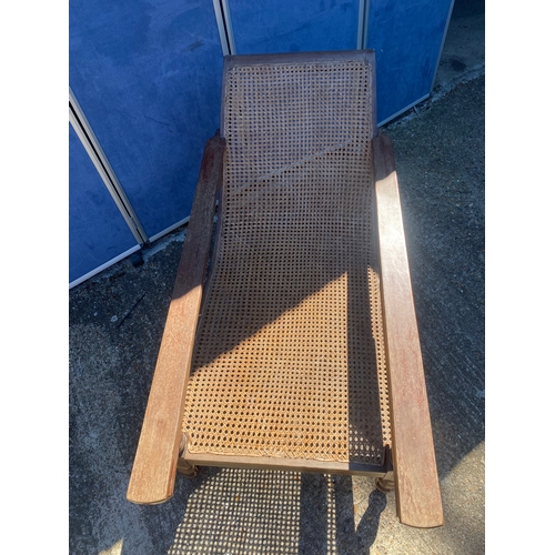 341 - EARLY 20TH CENTURY TEAK COLONIAL PLANTERS CHAIR WITH RATTAN WEAVE