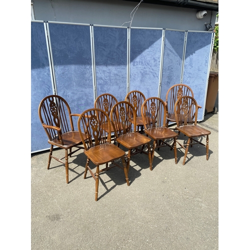 352 - Eight mahogany wheel back chairs including two carver style.