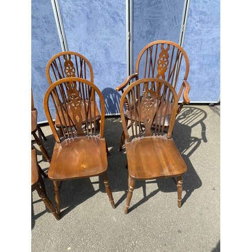 352 - Eight mahogany wheel back chairs including two carver style.