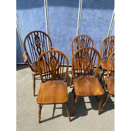 352 - Eight mahogany wheel back chairs including two carver style.