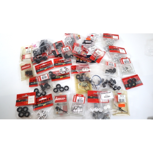 19 - Collection of new in bag Cartrix, Ninco Slot Car Model Racing accessories, wheels, tyres etc