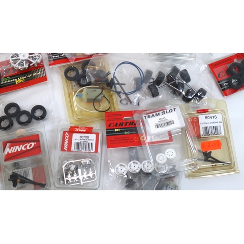 19 - Collection of new in bag Cartrix, Ninco Slot Car Model Racing accessories, wheels, tyres etc