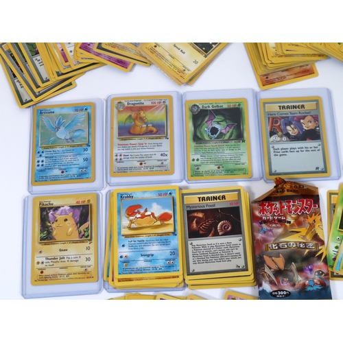 202 - Pokemon TCG - A group of 4 holographic cards from Fossil and Team Rocket Sets Articuno, Dragonite, D... 