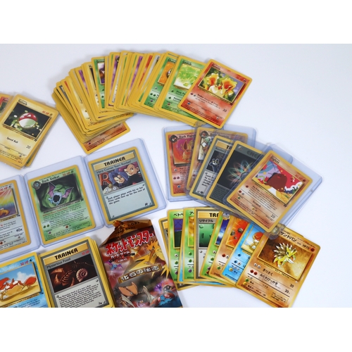 202 - Pokemon TCG - A group of 4 holographic cards from Fossil and Team Rocket Sets Articuno, Dragonite, D... 