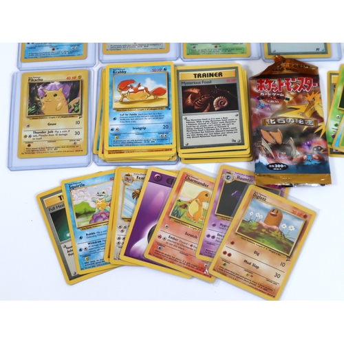 202 - Pokemon TCG - A group of 4 holographic cards from Fossil and Team Rocket Sets Articuno, Dragonite, D... 