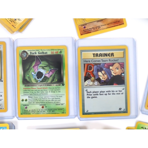 202 - Pokemon TCG - A group of 4 holographic cards from Fossil and Team Rocket Sets Articuno, Dragonite, D... 