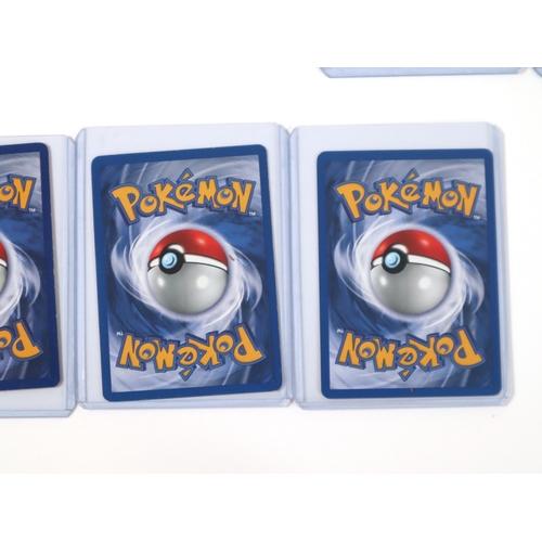 202 - Pokemon TCG - A group of 4 holographic cards from Fossil and Team Rocket Sets Articuno, Dragonite, D... 