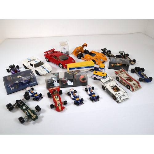 80 - Collection of various cased & loose die cast model racers / F1 / Grand Prix models / helmets includi... 