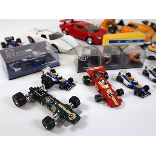 80 - Collection of various cased & loose die cast model racers / F1 / Grand Prix models / helmets includi... 