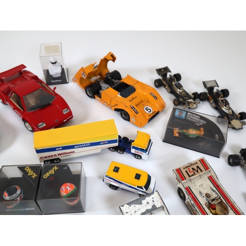 80 - Collection of various cased & loose die cast model racers / F1 / Grand Prix models / helmets includi... 