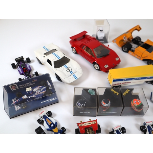 80 - Collection of various cased & loose die cast model racers / F1 / Grand Prix models / helmets includi... 