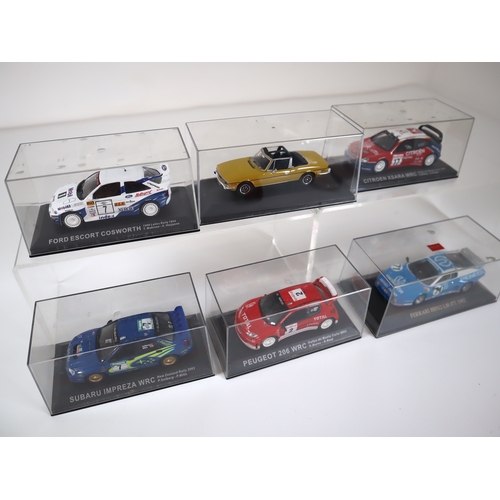 85 - Cased 1:32 Scale Die-cast Rally Model Cars Ford Escort Coswroth, Subaru Impreza WRC, Peugeot 206 WRC... 