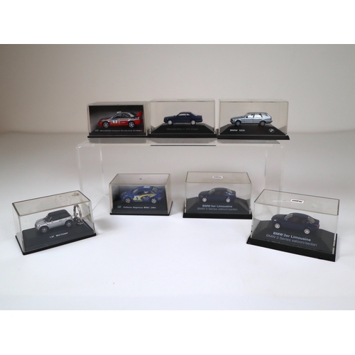 106 - Collection of 1:64 Scale cased model cars including Subaru Impreza WRC, Lancer Evolution WRC, BMW's ... 