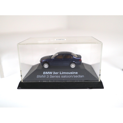 106 - Collection of 1:64 Scale cased model cars including Subaru Impreza WRC, Lancer Evolution WRC, BMW's ... 