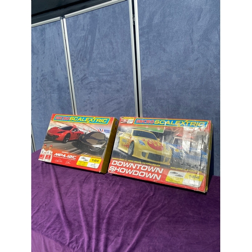 215 - Two micro scalextric MP4-12C and Downtown showdown