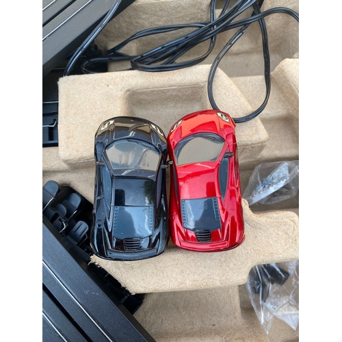 215 - Two micro scalextric MP4-12C and Downtown showdown