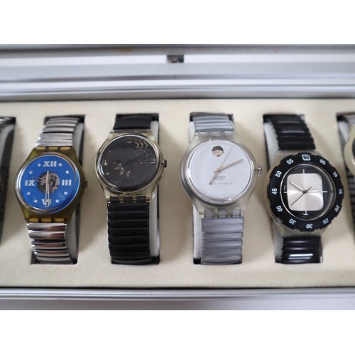 173 - 12 x Swatch Watches in Aluminium Display Case