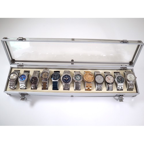 176 - 12 x Swatch Stainless / Aluminium Watches in Aluminium Display Case