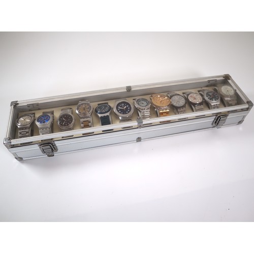 176 - 12 x Swatch Stainless / Aluminium Watches in Aluminium Display Case