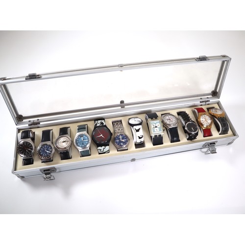 177 - 12 x Swatch Watches in Aluminium Display Case