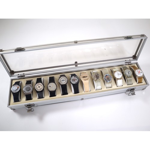 178 - 12 x Swatch Watches in Aluminium Display Case