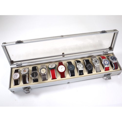 182 - 12 x Swatch Watches in Aluminium Display Case