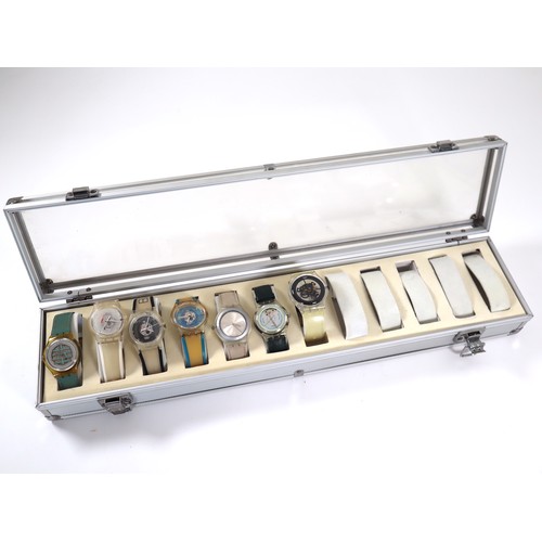 184 - 7 x Swatch Skin Watches in Aluminium Display Case