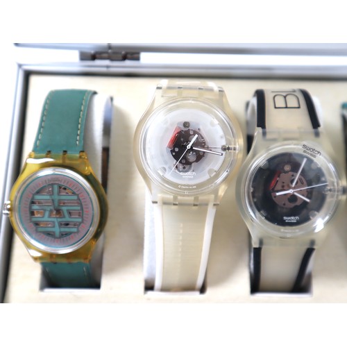 184 - 7 x Swatch Skin Watches in Aluminium Display Case