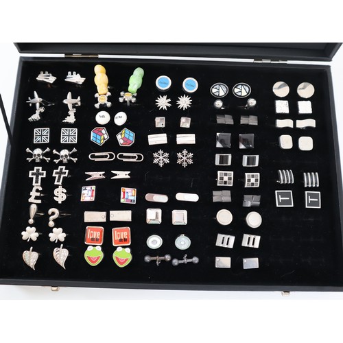 194 - Collection of various cufflinks in display case