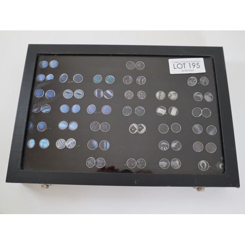 195 - Collection of Blue & Black Round Fabric cufflinks in display case