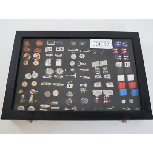 197 - Collection of novelty cufflinks in display case