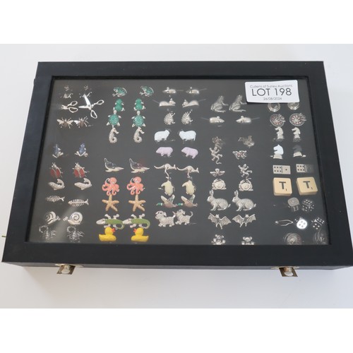 198 - Collection of novelty cufflinks animals / games in display case