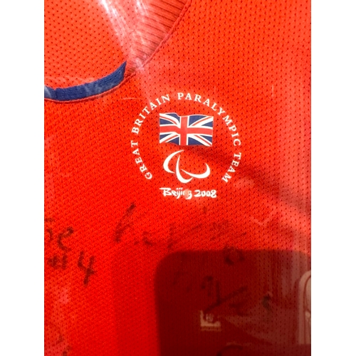 229 - Framed & Signed Great Britain Paralympics Team Beijing 2008 Jersey signed by Athletes 54cm x 76cm